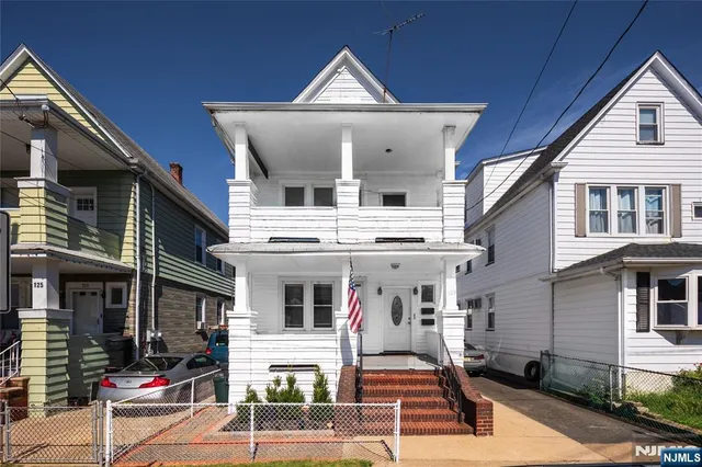 a view of parked car in front of building