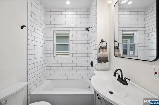 a bathroom with a sink and a shower