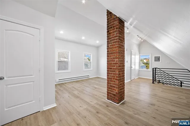 wooden floor in an empty room with a gallery