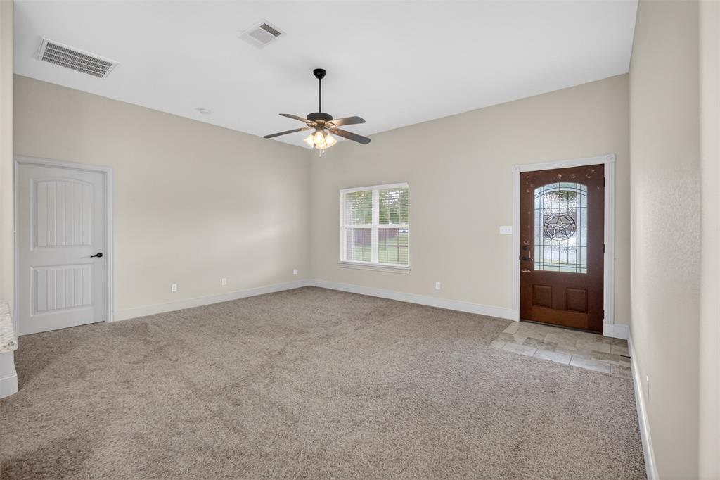 505 East 5th Street Springtown, TX 76082 - Photo 7 of 39 a view of an empty room with a window