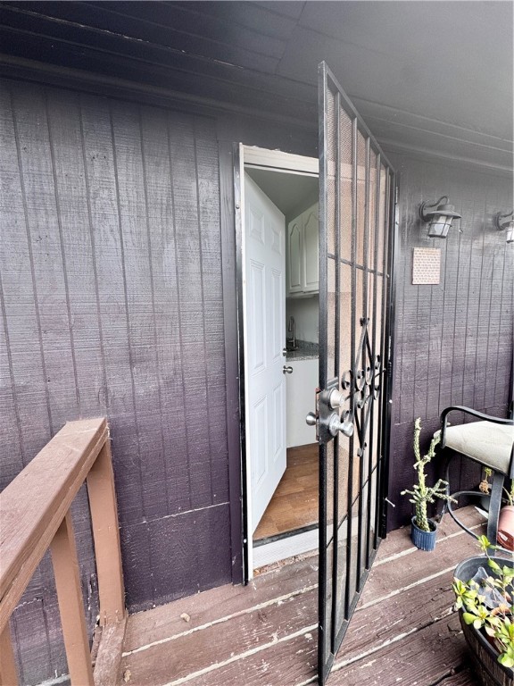 907 Elizabeth Street, Unit 4 Corpus Christi, TX 78404 - Photo 10 of 11 a view of a hallway and a dining room with furniture and a window