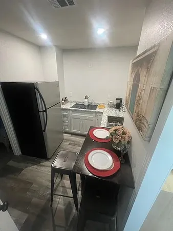 a table with chairs and a stove