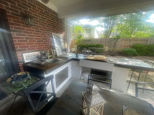 a kitchen with a sink stove and cabinets