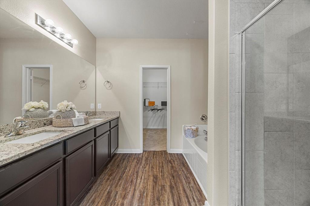 2212 Georgetown Street Princeton, TX 75407 - Photo 15 of 31 a bathroom with a double vanity sink and mirror