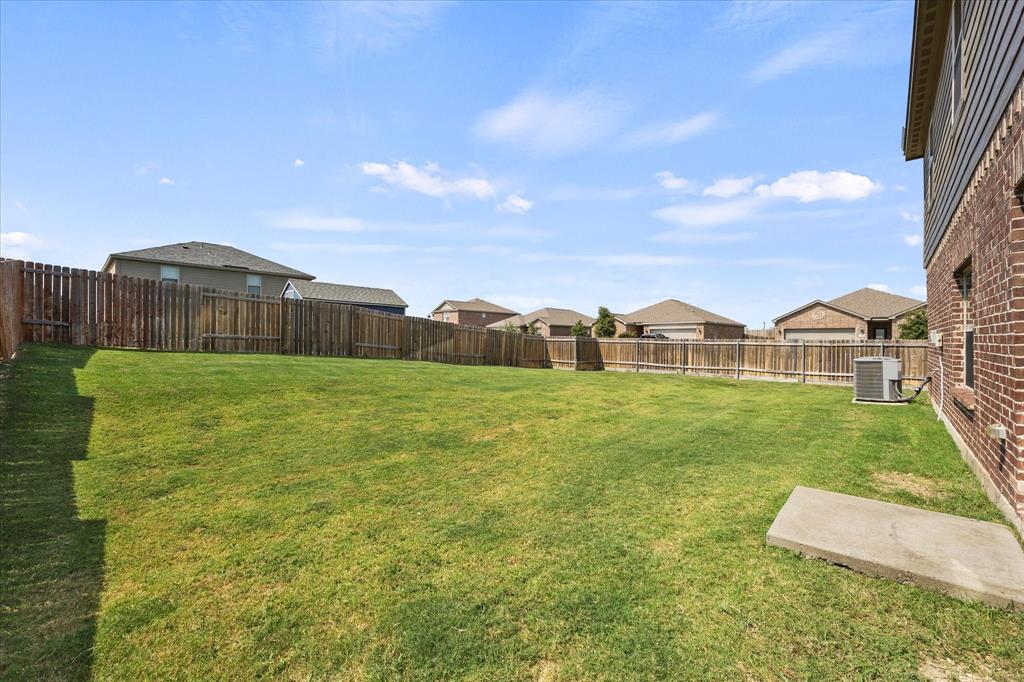 2212 Georgetown Street Princeton, TX 75407 - Photo 23 of 31 a view of a green field