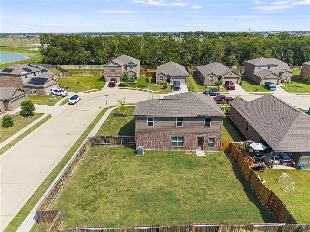 2212 Georgetown Street Princeton, TX 75407 - Photo 29 of 31 a view of a house with a swimming pool