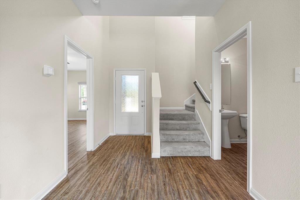 2212 Georgetown Street Princeton, TX 75407 - Photo 4 of 31 a view of a hallway with wooden floor and entryway