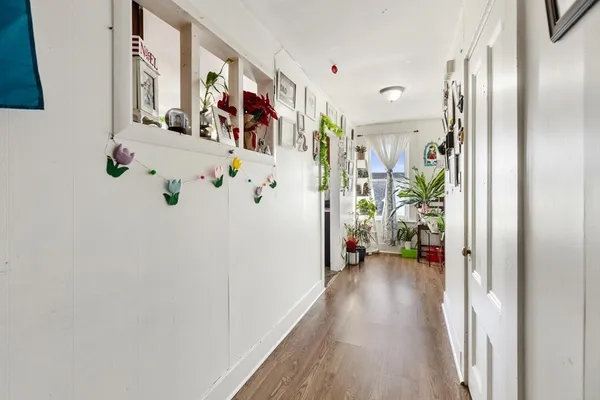 a kitchen with stainless steel appliances a stove a refrigerator and a dining table