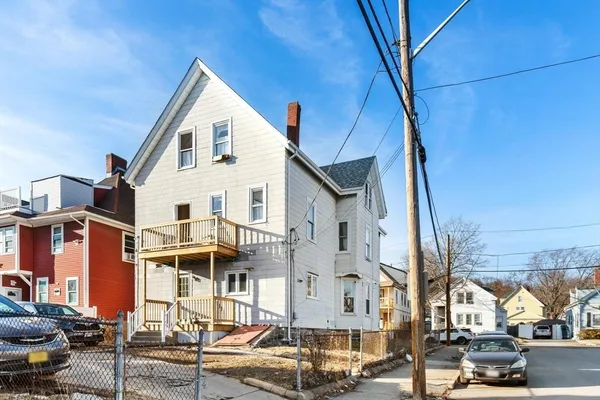 a view of residential houses with street