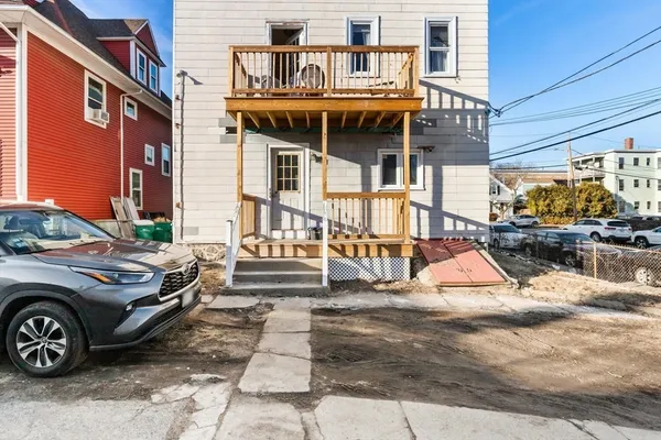 a view of a car park in front of house