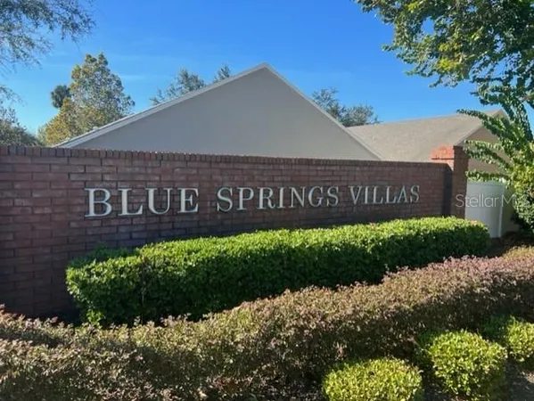 a view of a sign board with a house