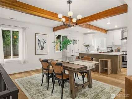 a view of a dining room with furniture window and wooden floor