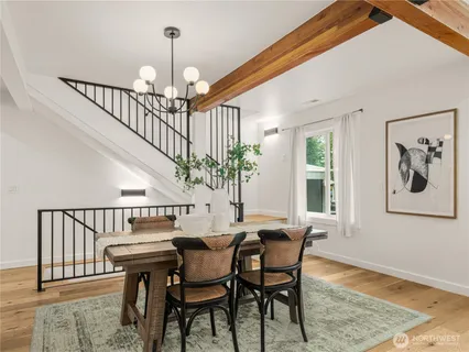 a view of a dining room with furniture window and wooden floor