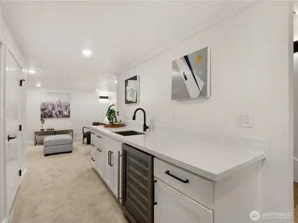 a spacious bathroom with a double vanity sink and a mirror