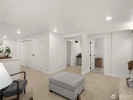 a spacious bedroom with a bed and furniture