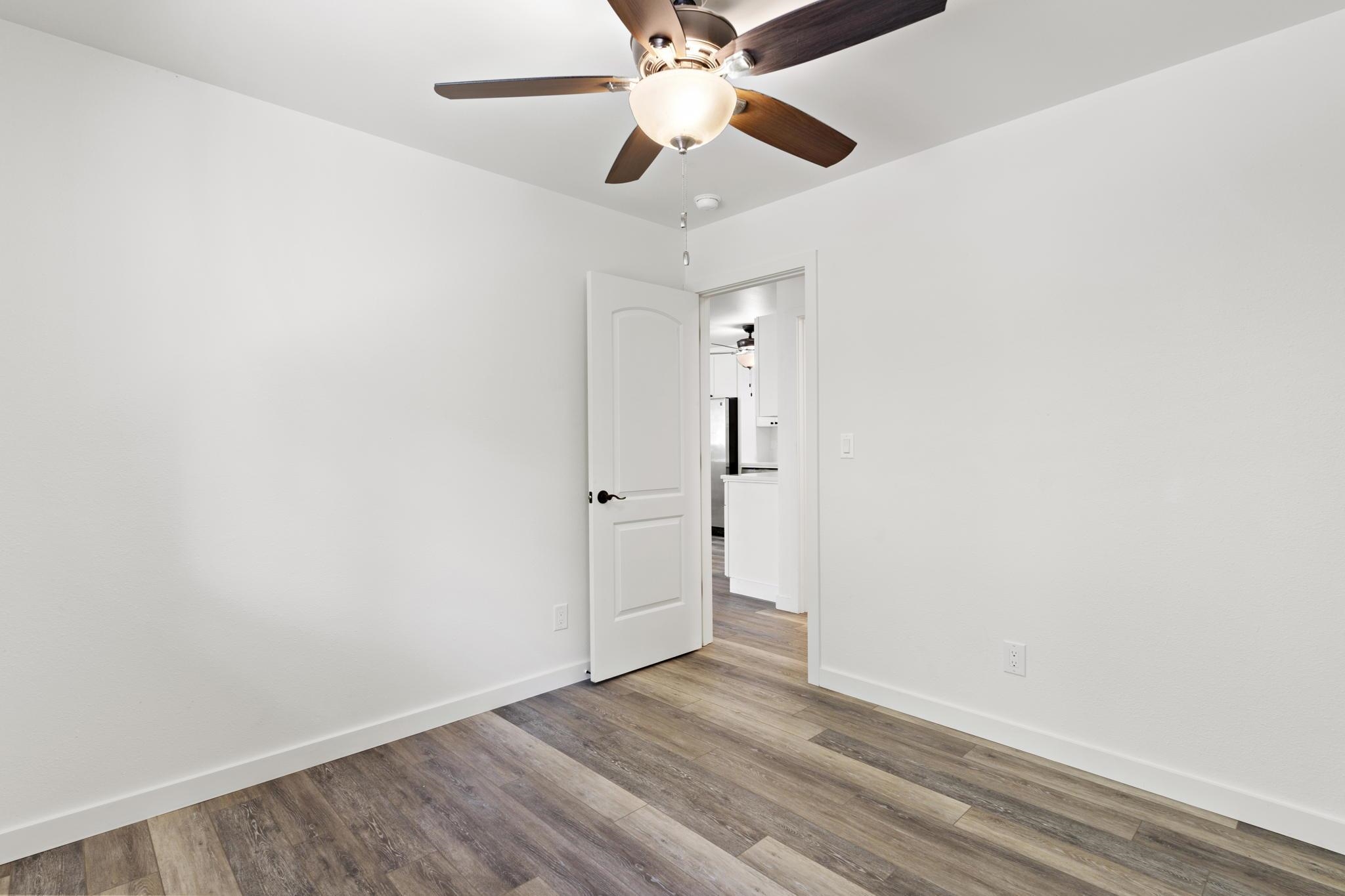 14 Kahiapo Place Haiku, HI 96708 - Photo 18 of 30 an empty room with a window and a ceiling fan