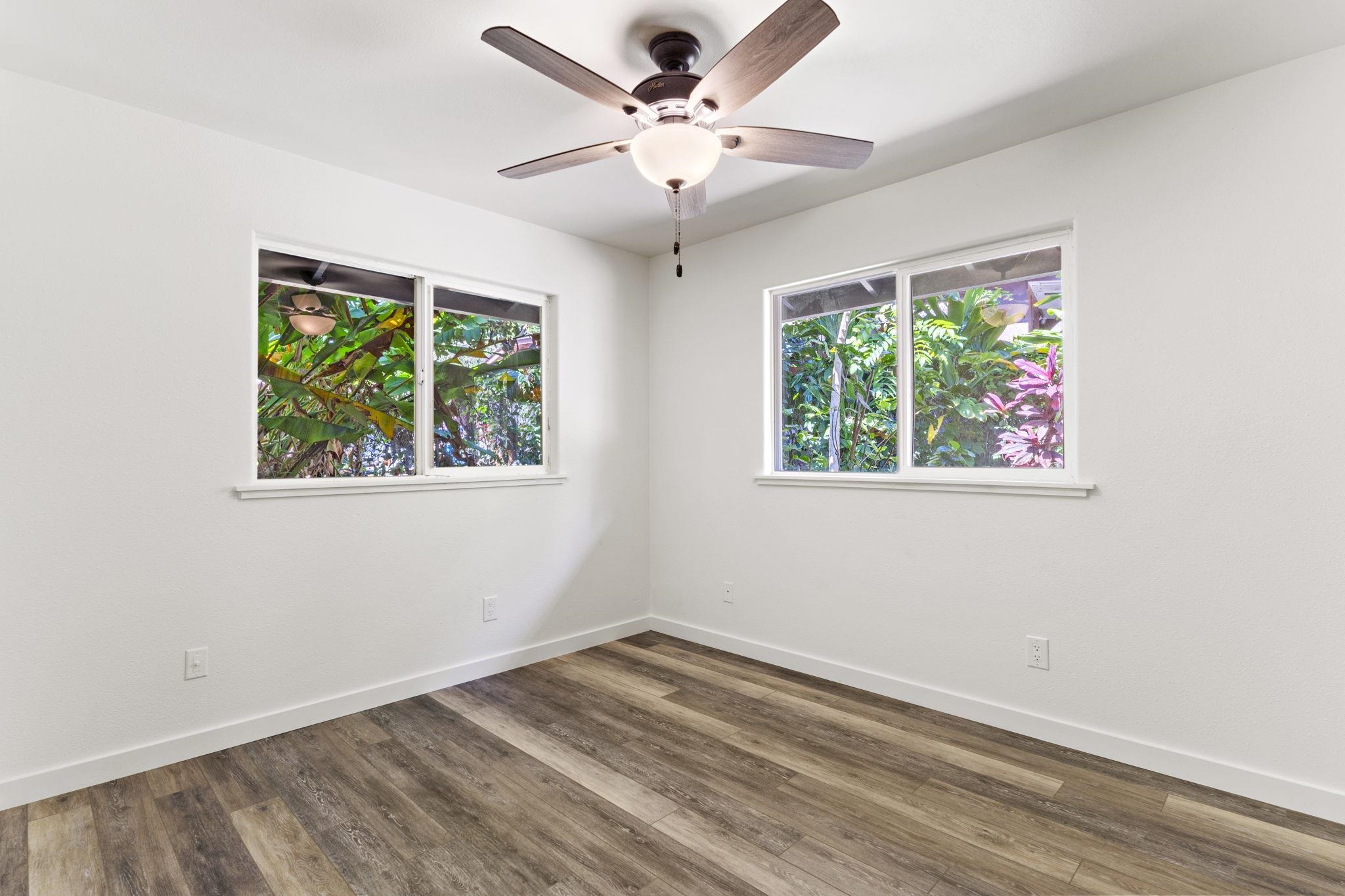 14 Kahiapo Place Haiku, HI 96708 - Photo 21 of 30 an empty room with a window and a ceiling fan
