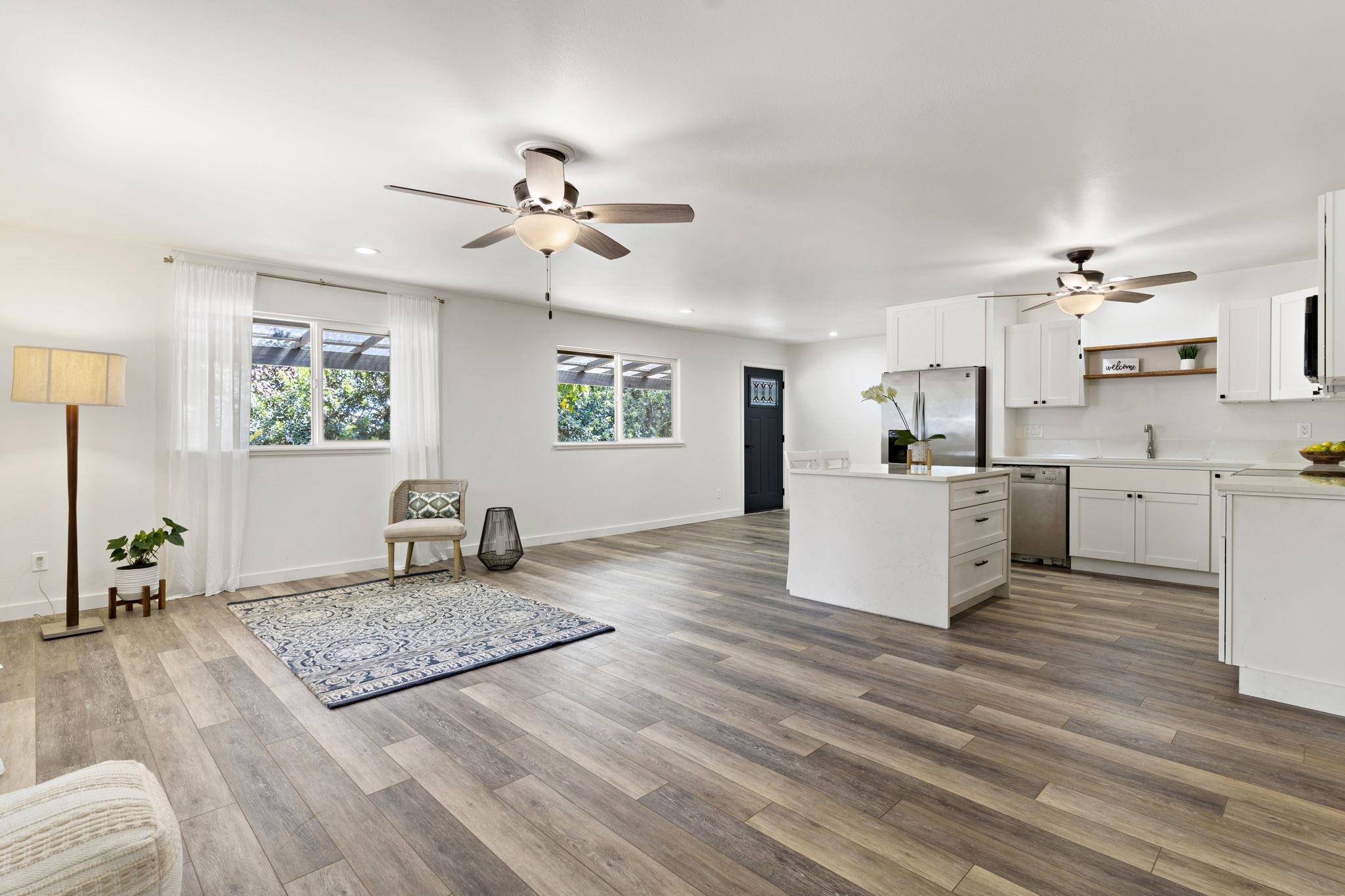 14 Kahiapo Place Haiku, HI 96708 - Photo 4 of 30 a living room with kitchen island furniture and a wooden floor
