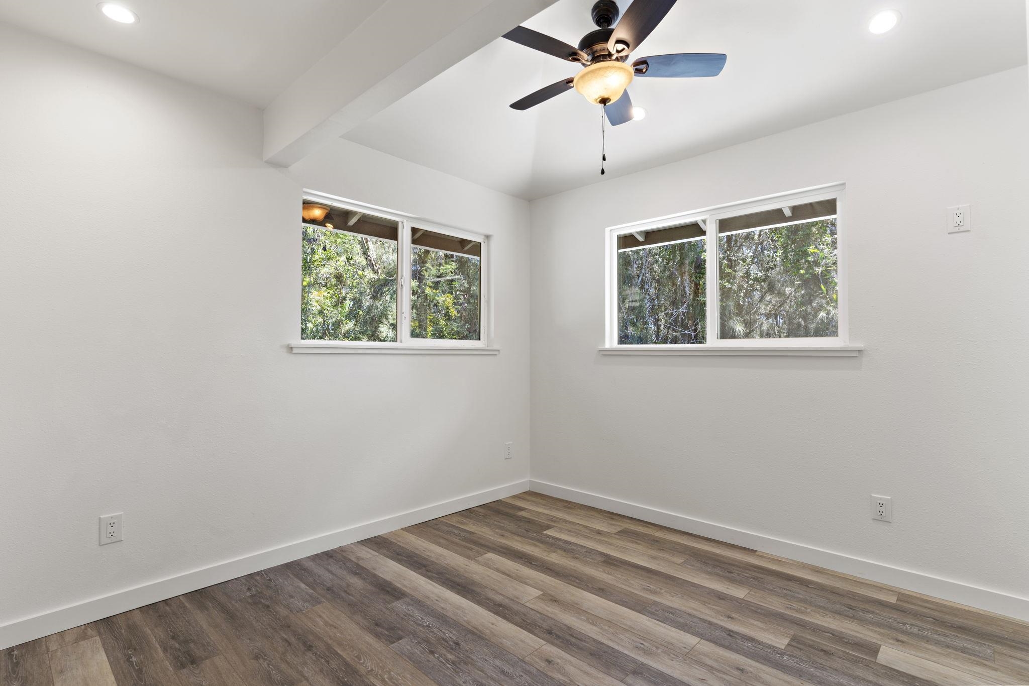 14 Kahiapo Place Haiku, HI 96708 - Photo 10 of 30 a view of empty room with wooden floor and fan
