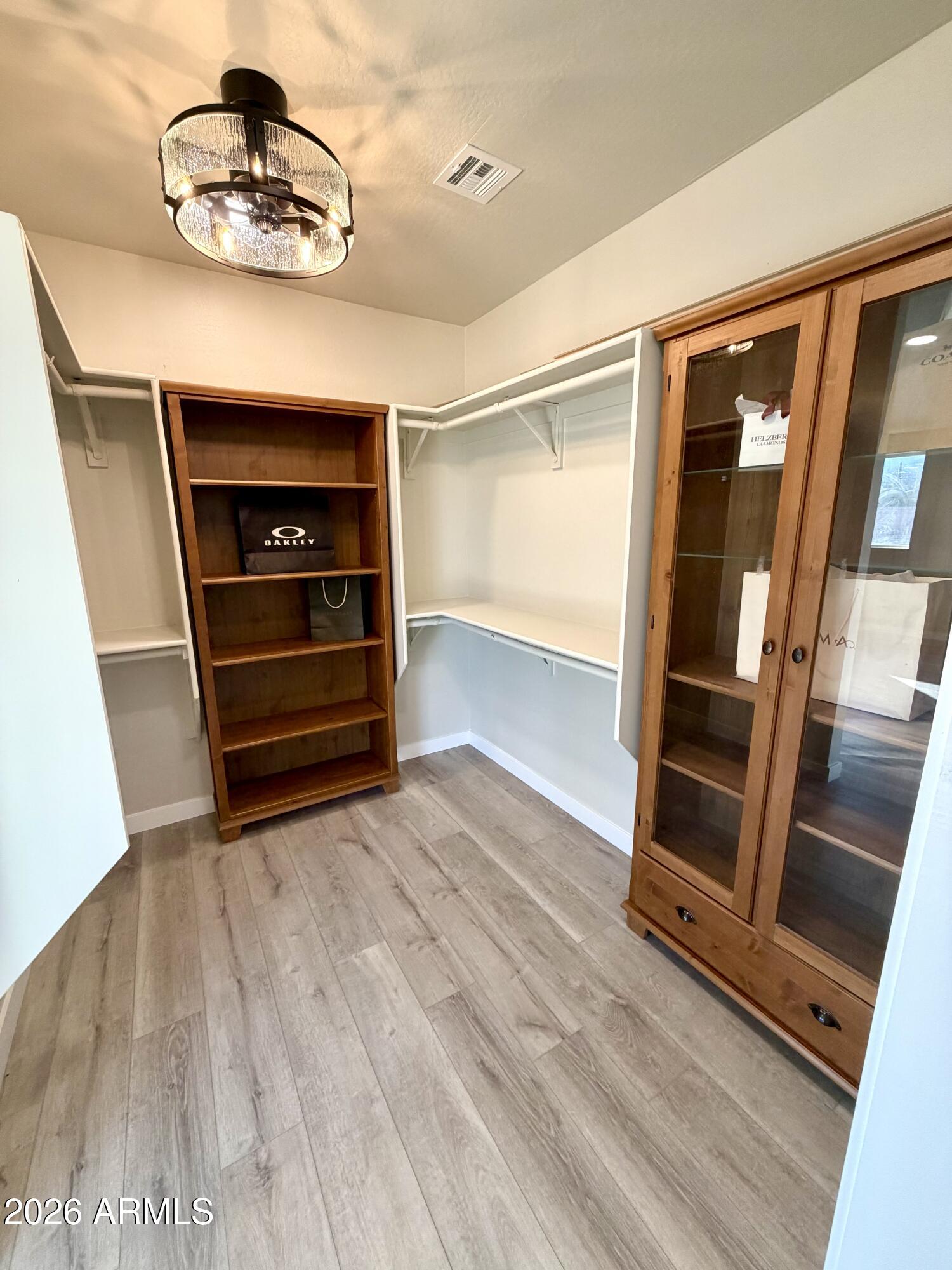 1165 North Mountain View Road Apache Junction, AZ 85119 - Photo 13 of 29 a view of an empty room with wooden floor and stairs