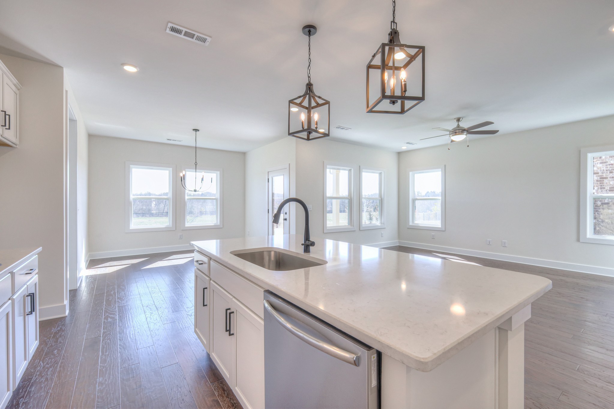 620 Phoebe Way Gallatin, TN 37066 - Photo 9 of 38 a kitchen with stainless steel appliances granite countertop a sink a window and wooden floor