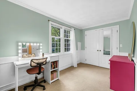 a workspace with furniture and window