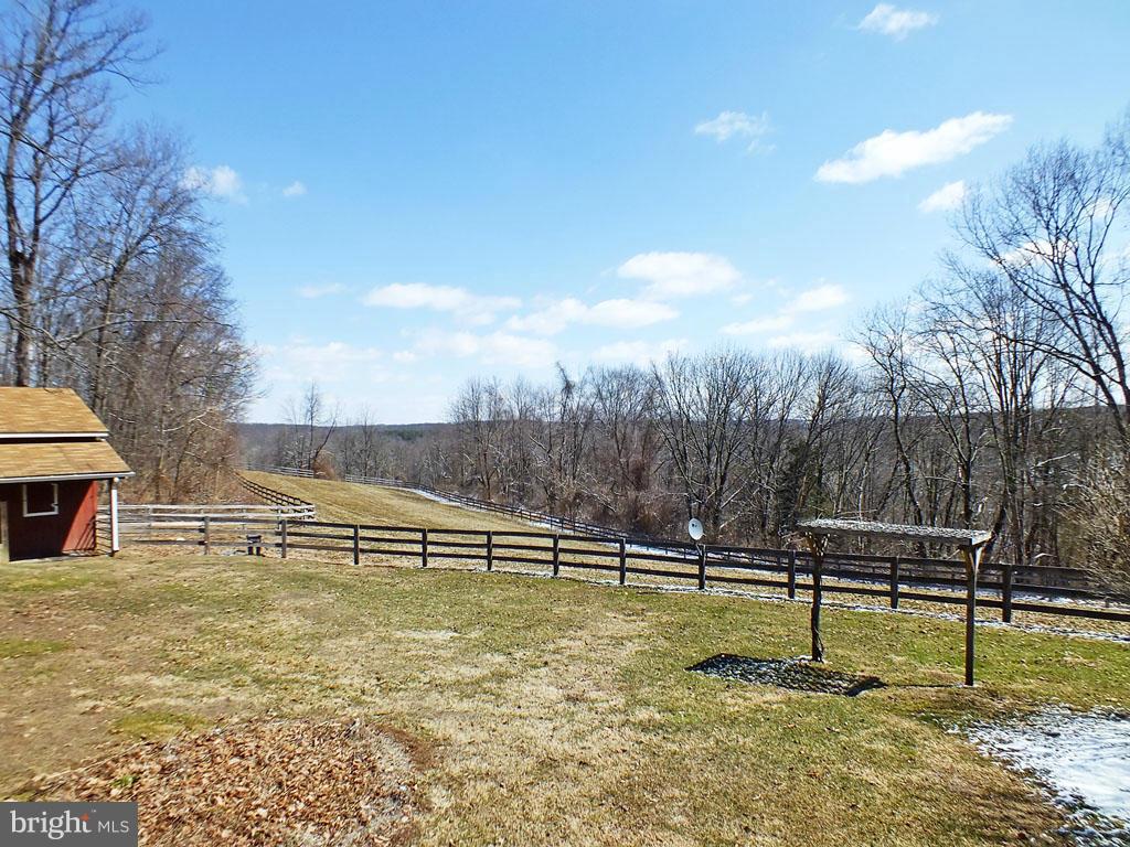 19121 Falls Road Hampstead, MD 21074 - Photo 2 of 26 a view of outdoor space with deck and yard