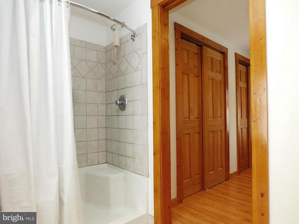 19121 Falls Road Hampstead, MD 21074 - Photo 13 of 26 a bathroom with a shower