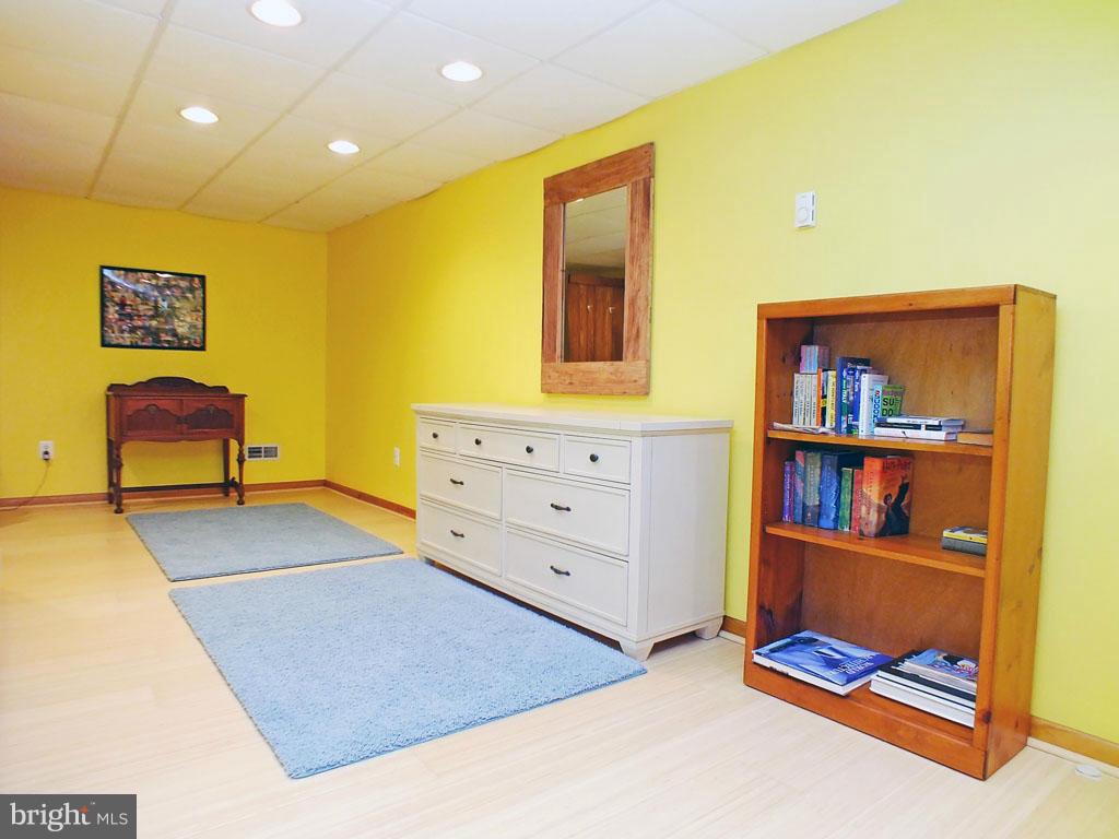 19121 Falls Road Hampstead, MD 21074 - Photo 19 of 26 a view of room with cabinet and couch