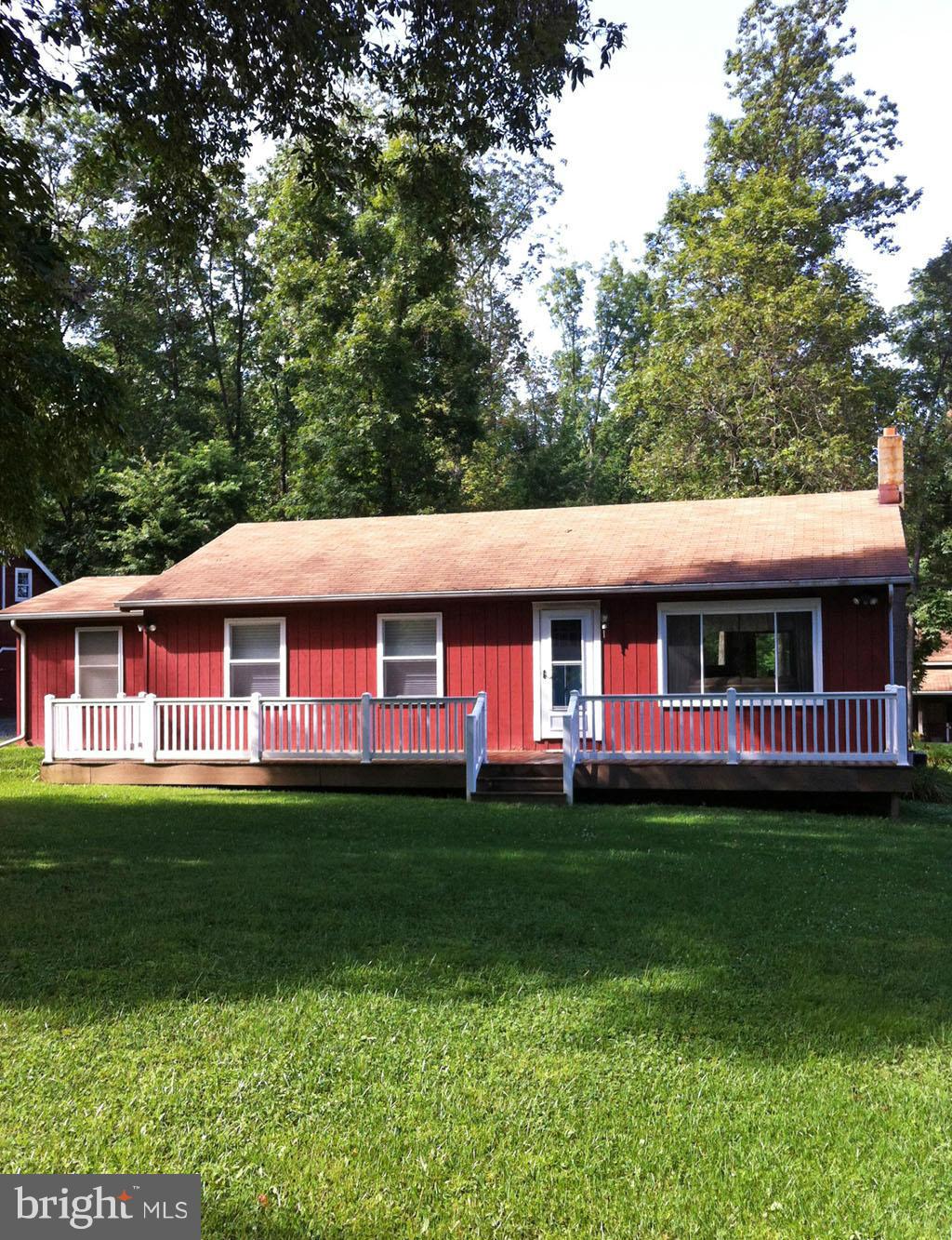 19121 Falls Road Hampstead, MD 21074 - Photo 20 of 26 a front view of a house with a garden