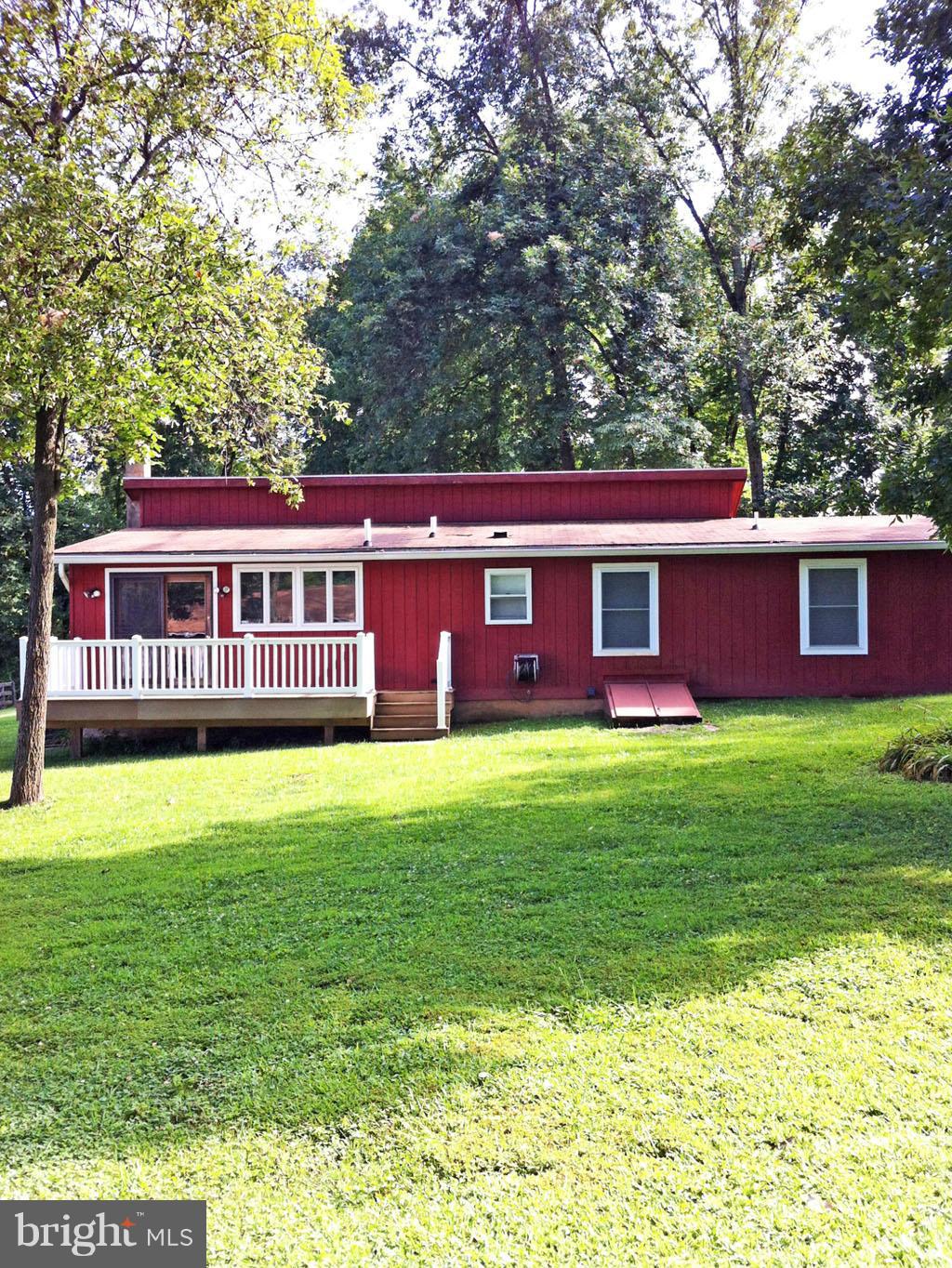 19121 Falls Road Hampstead, MD 21074 - Photo 21 of 26 a view of a house with a backyard