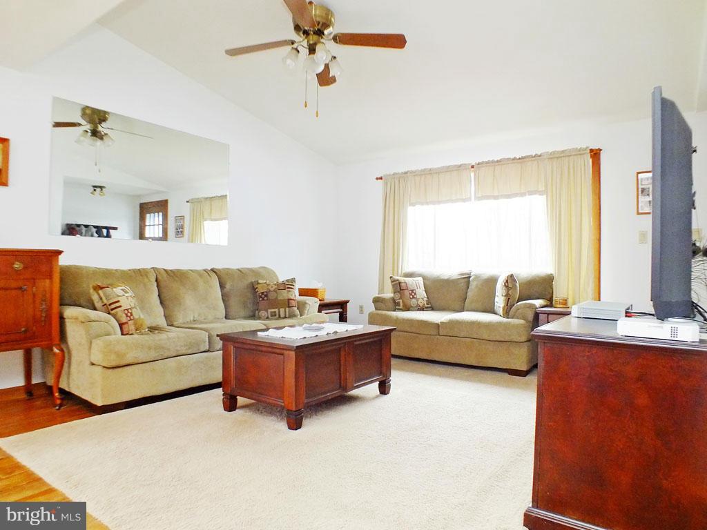 19121 Falls Road Hampstead, MD 21074 - Photo 4 of 26 a living room with furniture and a large window