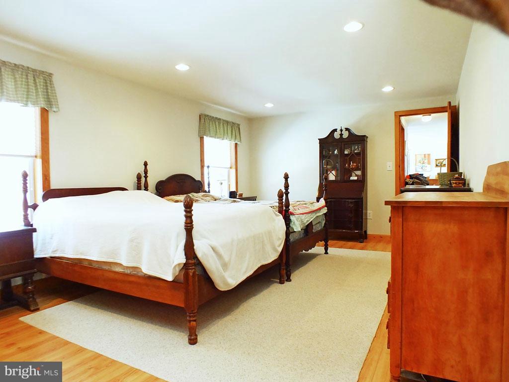19121 Falls Road Hampstead, MD 21074 - Photo 10 of 26 a bedroom with bed and window