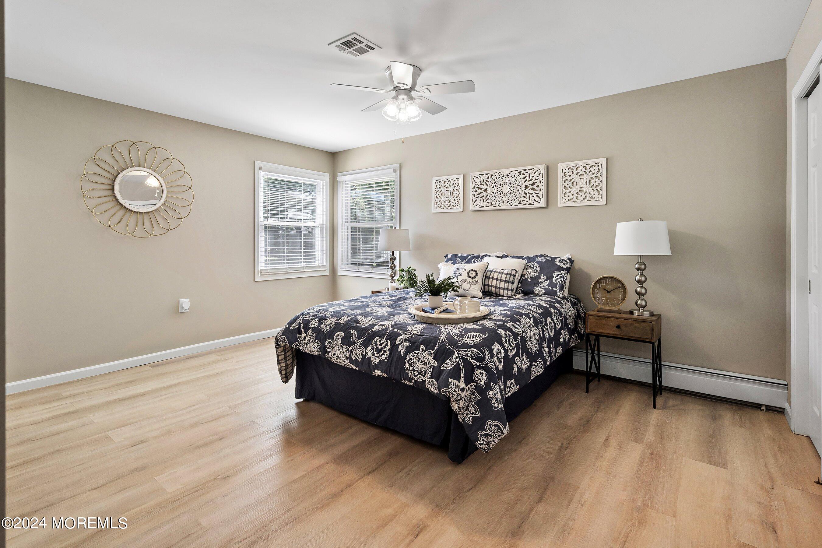21 Tapola Road Toms River, NJ 08757 - Photo 14 of 22 a bedroom with a bed dresser and a window