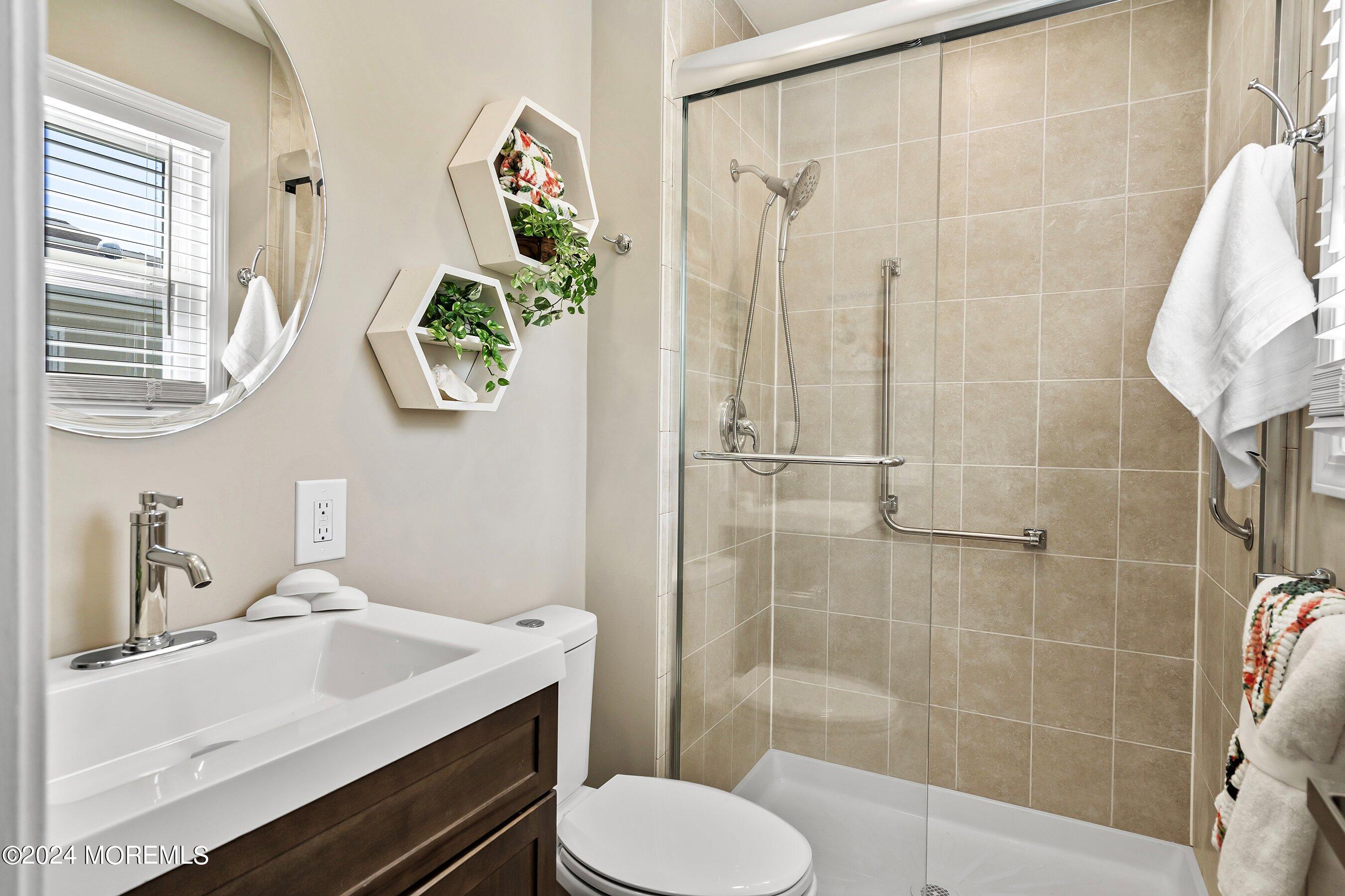 21 Tapola Road Toms River, NJ 08757 - Photo 15 of 22 a bathroom with a sink toilet and shower