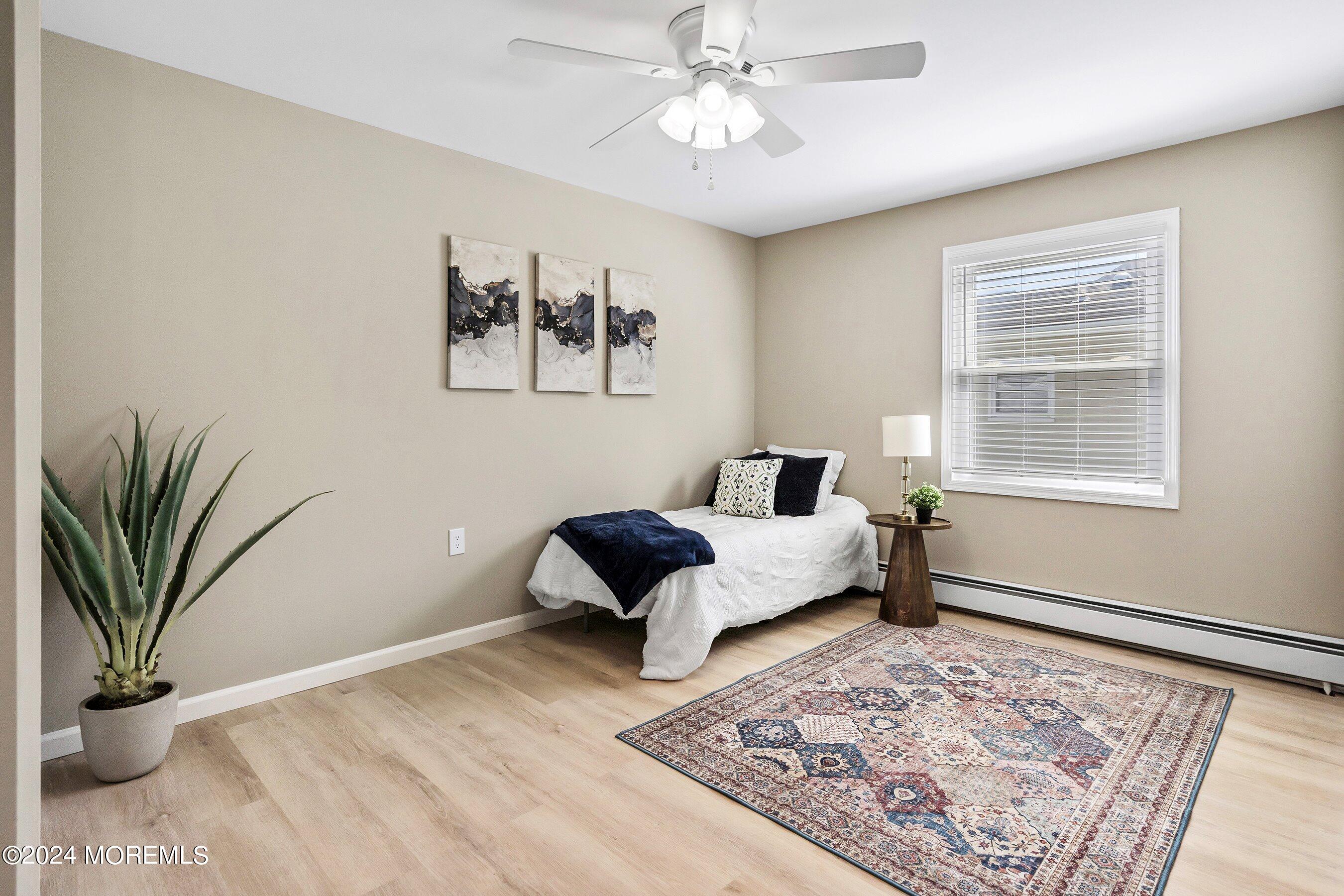 21 Tapola Road Toms River, NJ 08757 - Photo 16 of 22 a bed room with a bed and a couch