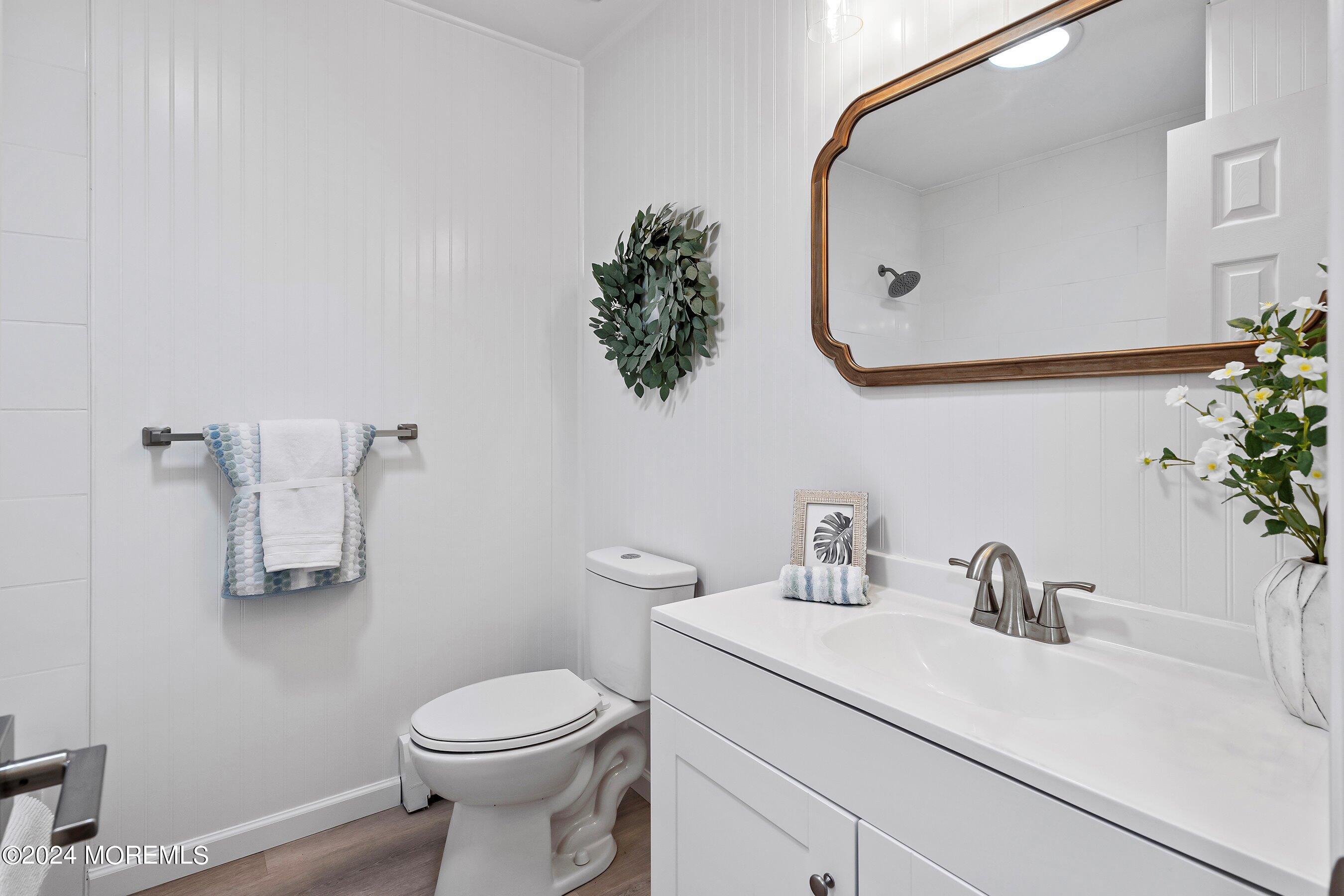 21 Tapola Road Toms River, NJ 08757 - Photo 17 of 22 a bathroom with a sink a mirror and toilet