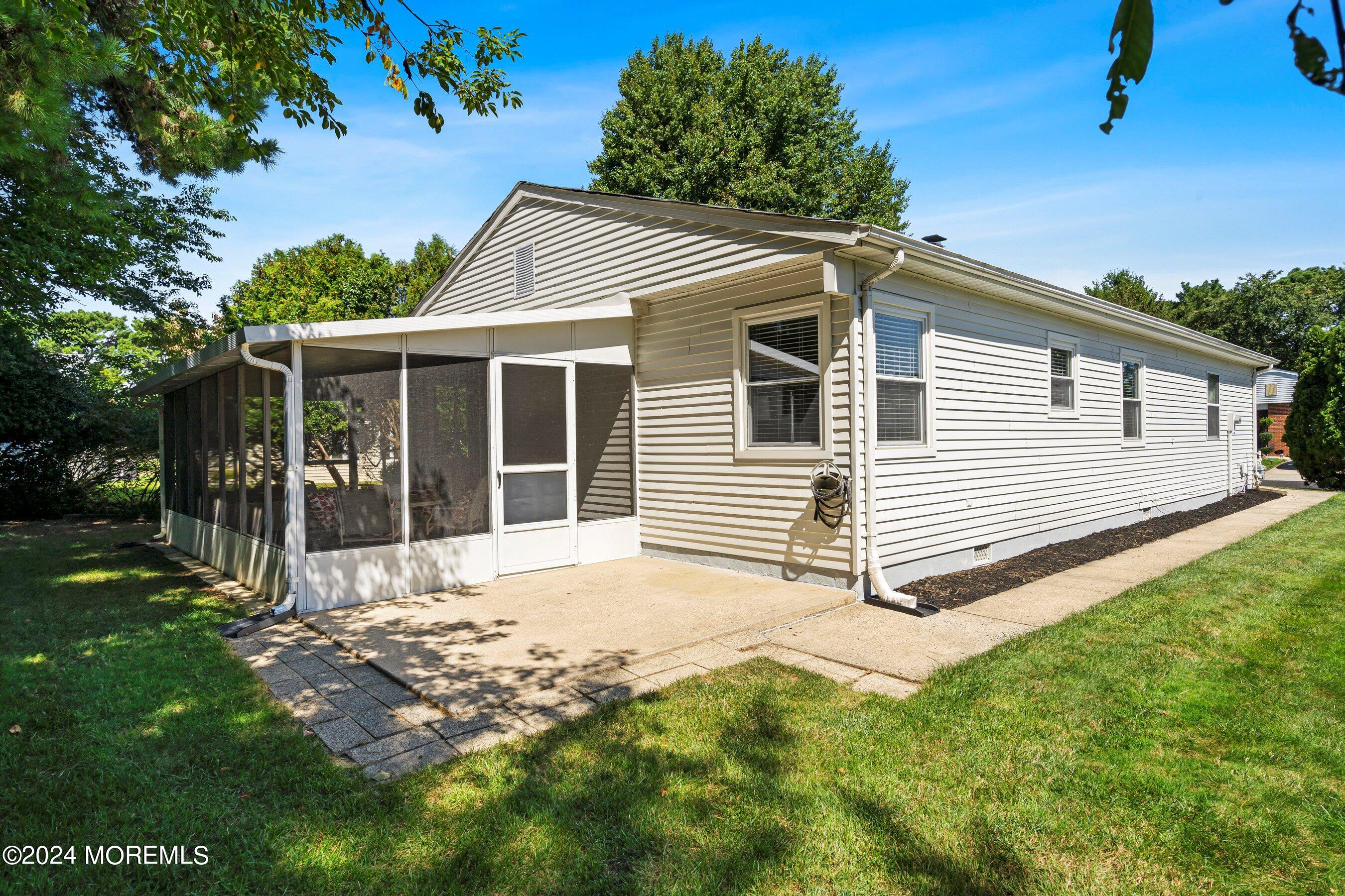 21 Tapola Road Toms River, NJ 08757 - Photo 19 of 22 a view of a house with a yard