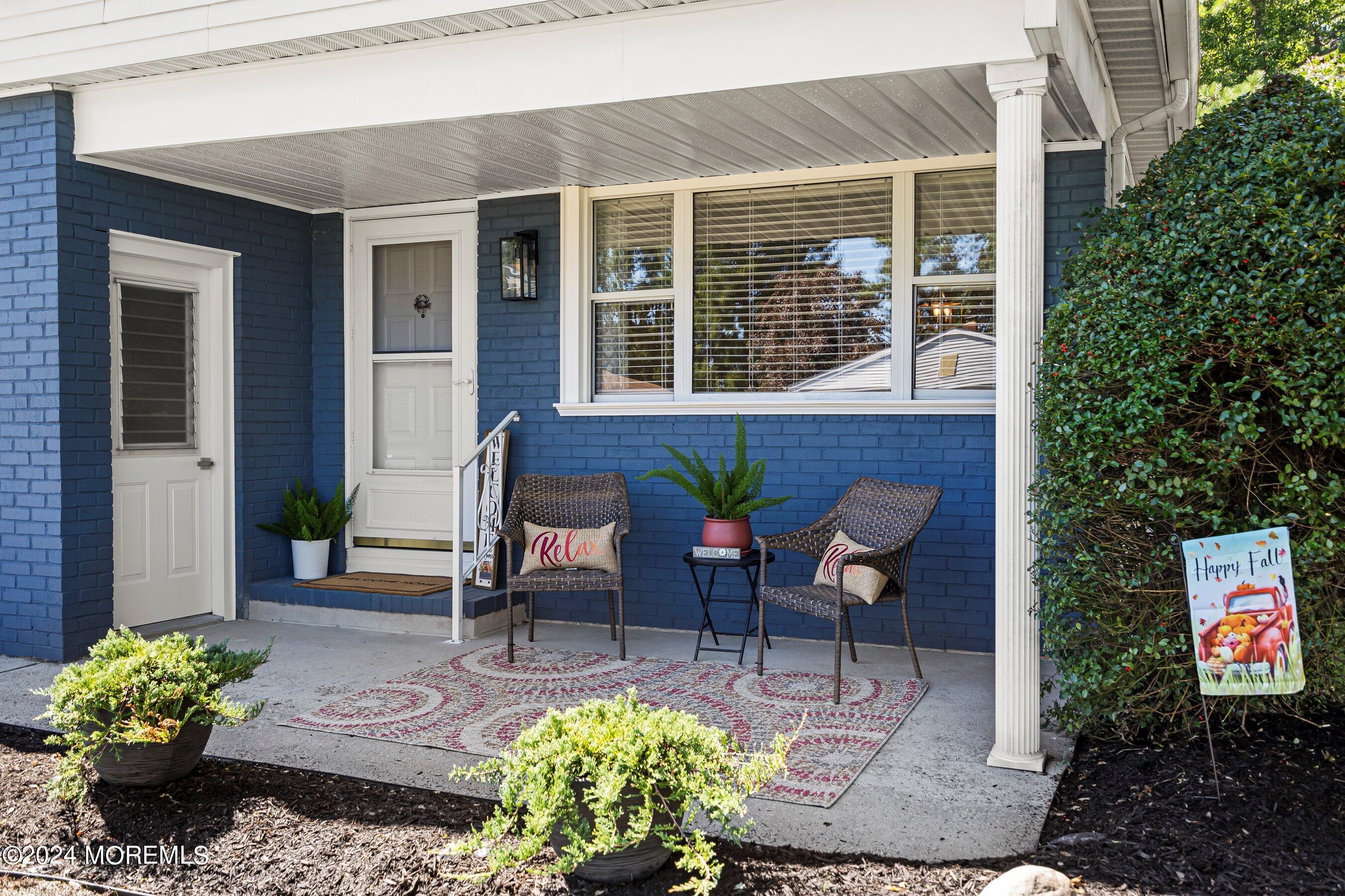 21 Tapola Road Toms River, NJ 08757 - Photo 2 of 22 a view of a patio with table and chairs and potted plants