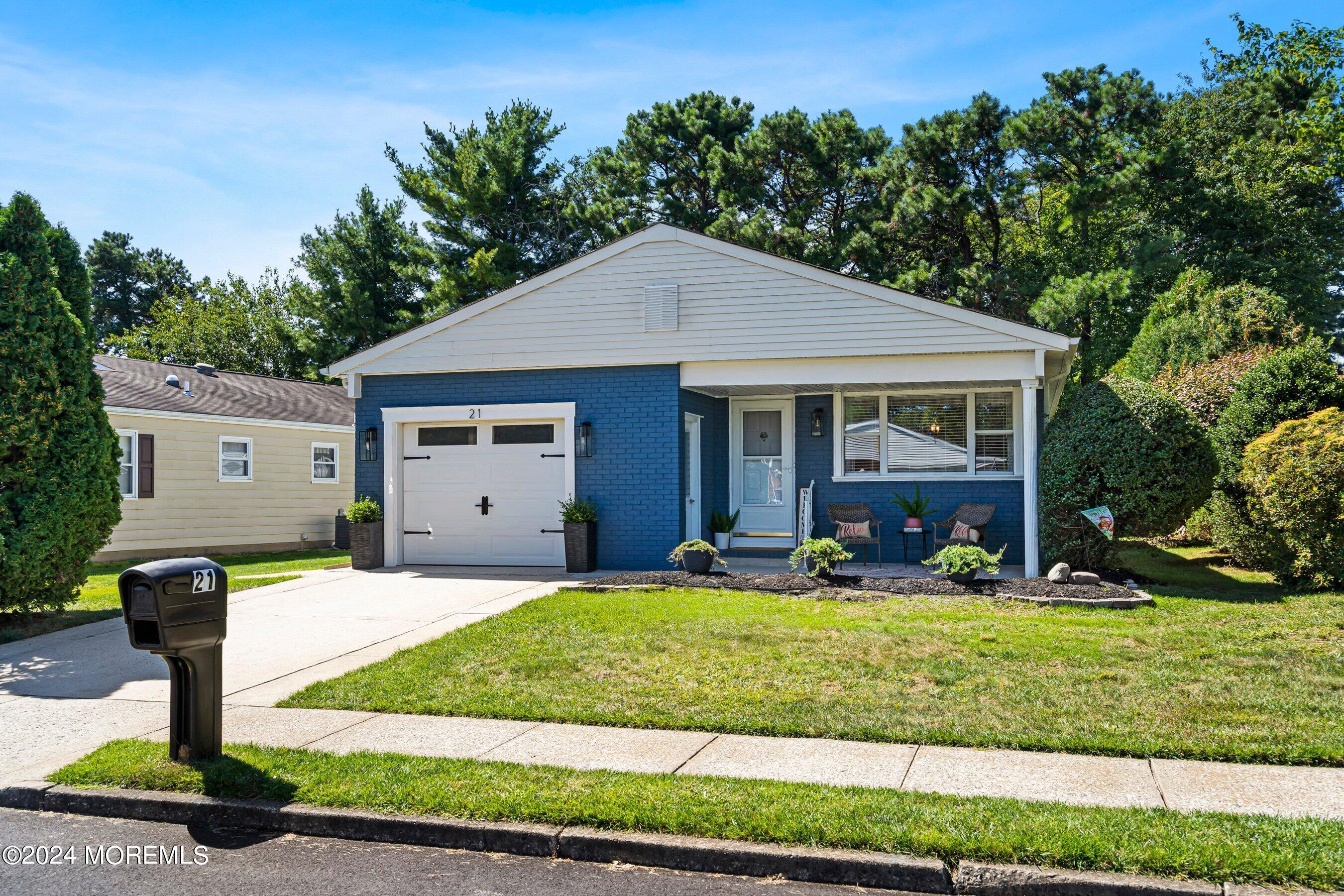 21 Tapola Road Toms River, NJ 08757 - Photo 3 of 22 a front view of a house with garden