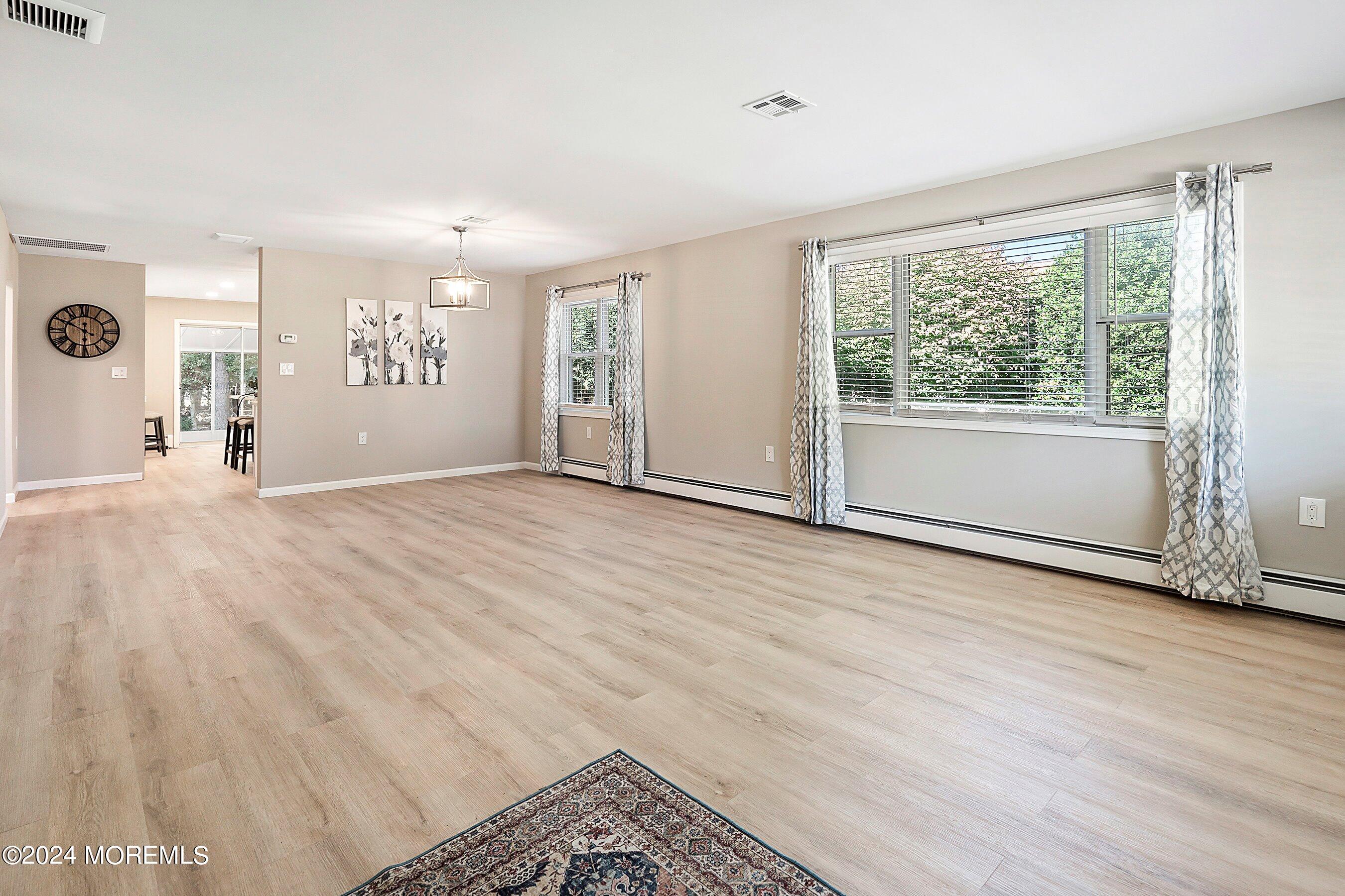 21 Tapola Road Toms River, NJ 08757 - Photo 4 of 22 a view of an empty room with a window