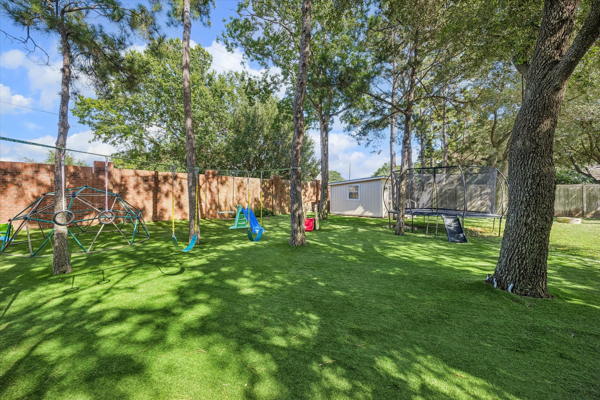 3047 Bonnebridge Way Boulevard Houston, TX 77082 - Photo 27 of 50 The expansive backyard presents a rare opportunity to have an ideal outdoor private play area retreat. With generous green space and endless potential for recreation or additional amenities.