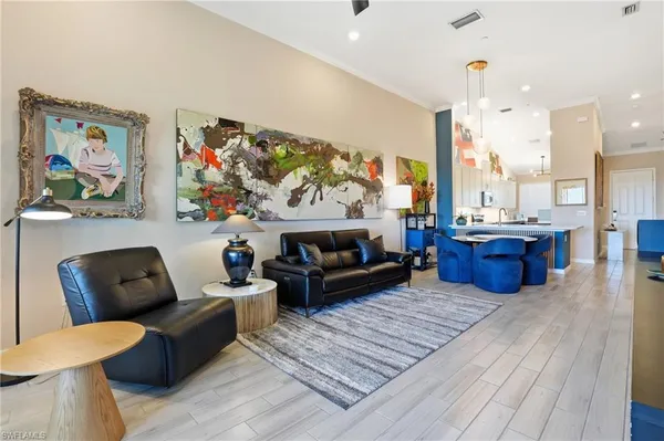 a living room with furniture a rug and a fireplace