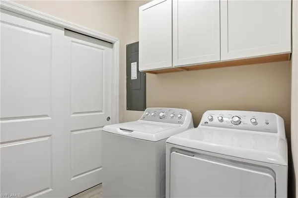 a utility room with dryer and washer