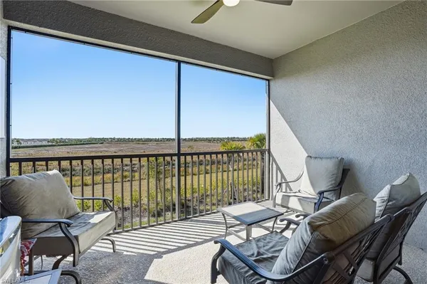 a view of a balcony with chairs