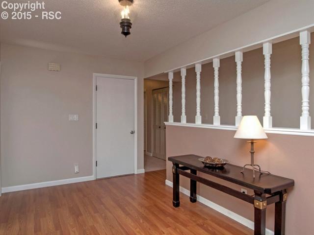 Beautiful entry way with spindle hall way leading to either living space or bedrooms 