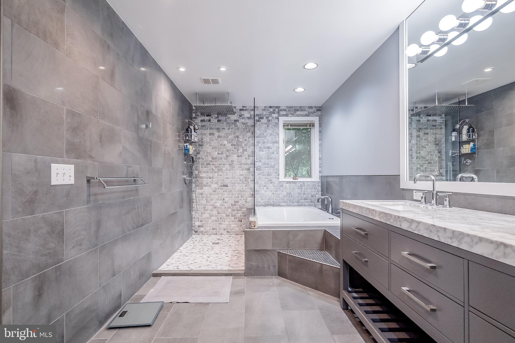 1361 South Leopard Road Berwyn, PA 19312 - Photo 16 of 33 a bathroom with a double vanity sink a toilet a mirror and shower