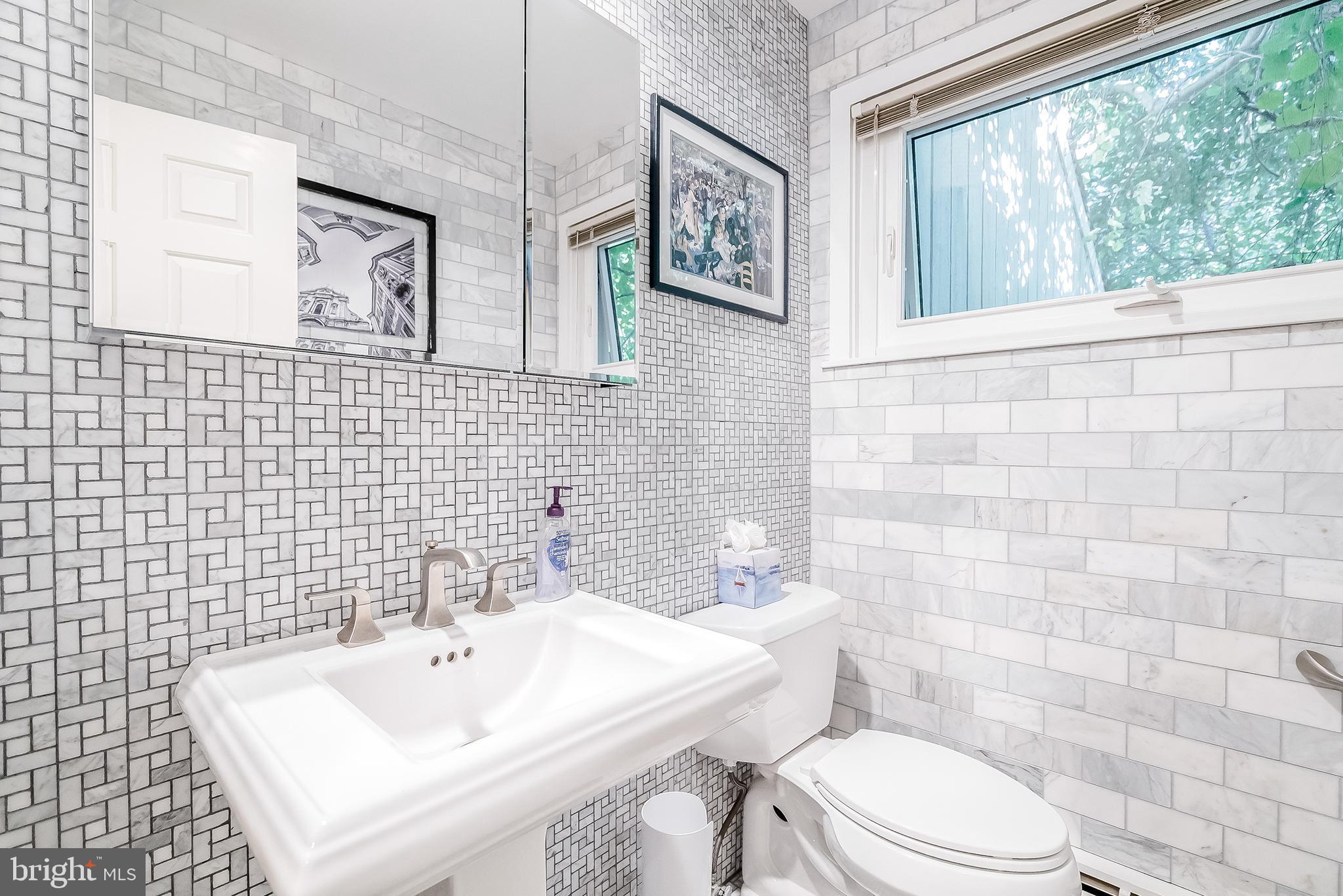 1361 South Leopard Road Berwyn, PA 19312 - Photo 19 of 33 a bathroom with a sink a toilet and mirror