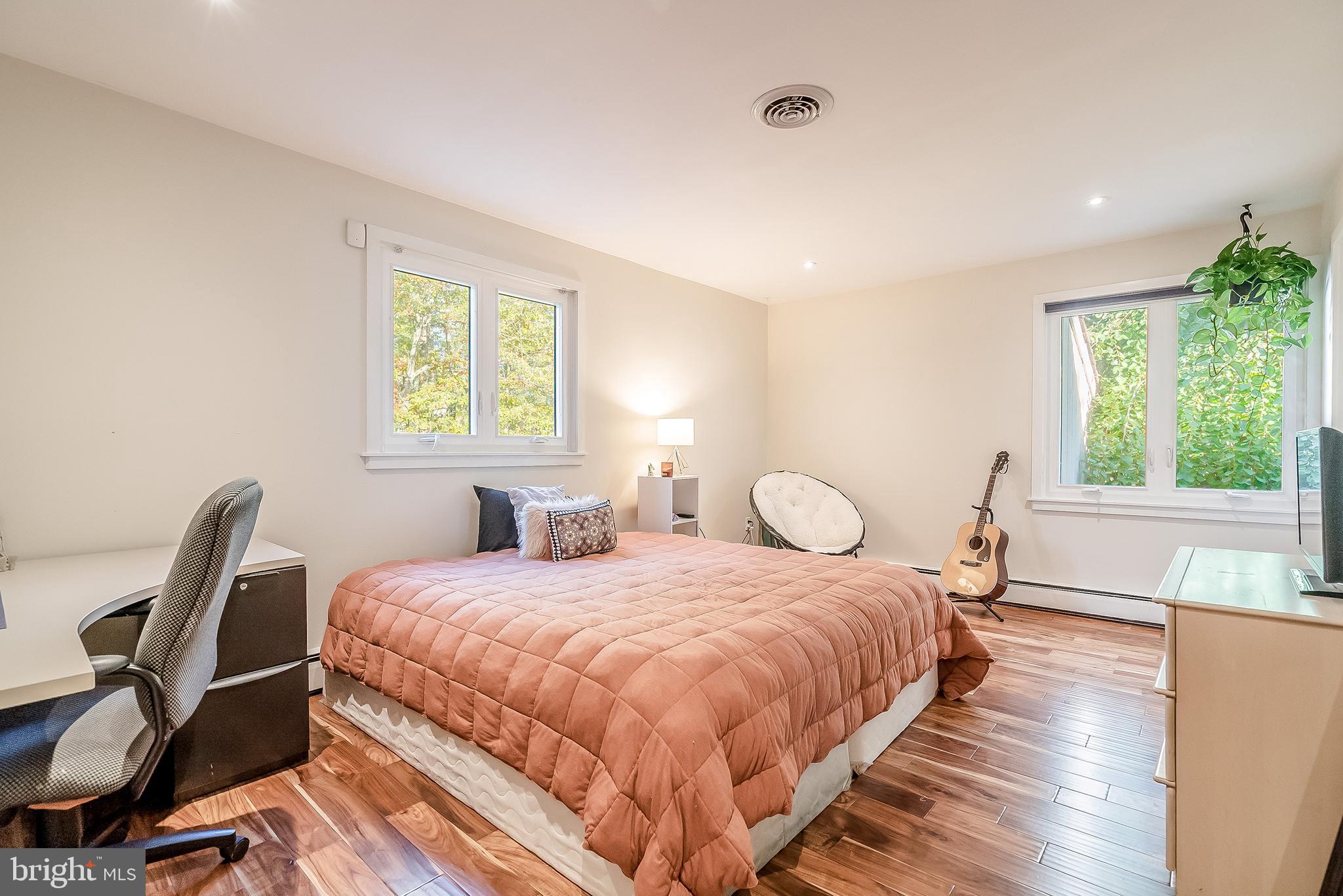 1361 South Leopard Road Berwyn, PA 19312 - Photo 22 of 33 a bedroom with a bed and a large window