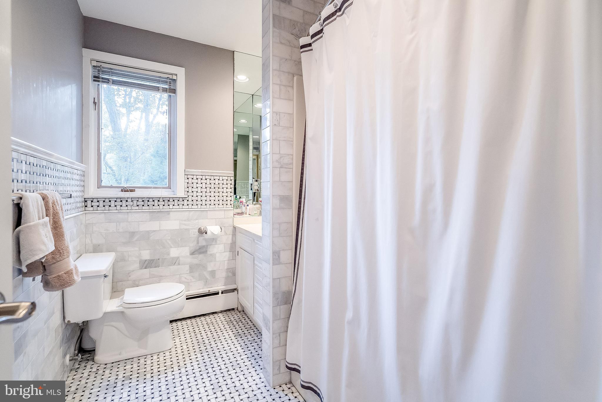 1361 South Leopard Road Berwyn, PA 19312 - Photo 25 of 33 a bathroom with a sink a toilet a window and shower